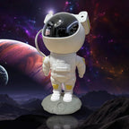 Astronaut galaxy projector with remote control on a wooden surface, ready to use.