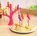 Set of colorful bird fruit forks with a tree holder, perfect for kids' snack time.