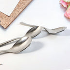 Set of three rust-resistant dining spoons neatly arranged
