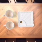 Centric ceramic tea cup set on display with plastic square serving platter