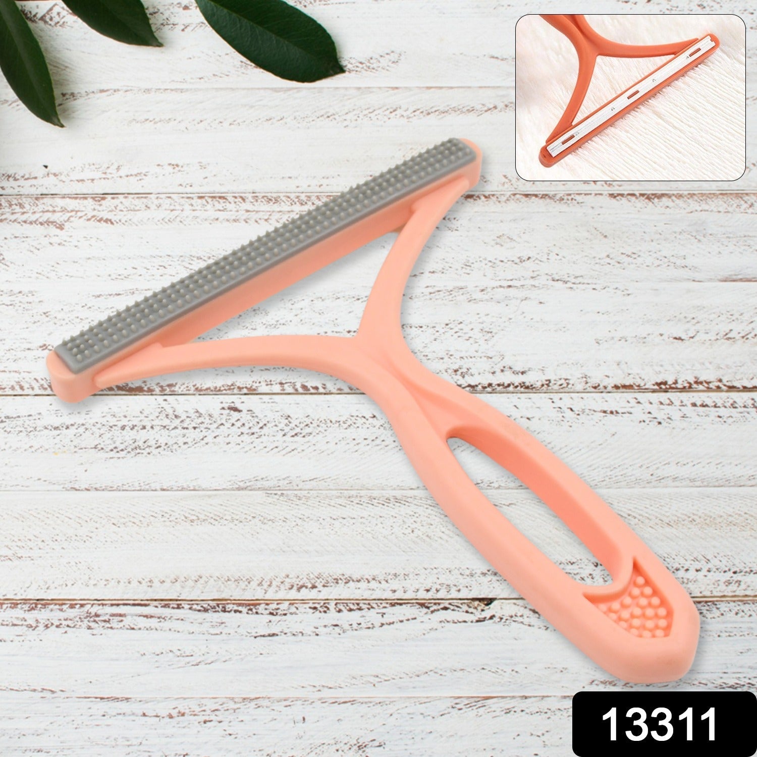 Compact double-sided lint brush, ideal for travel and quick clean-ups.
