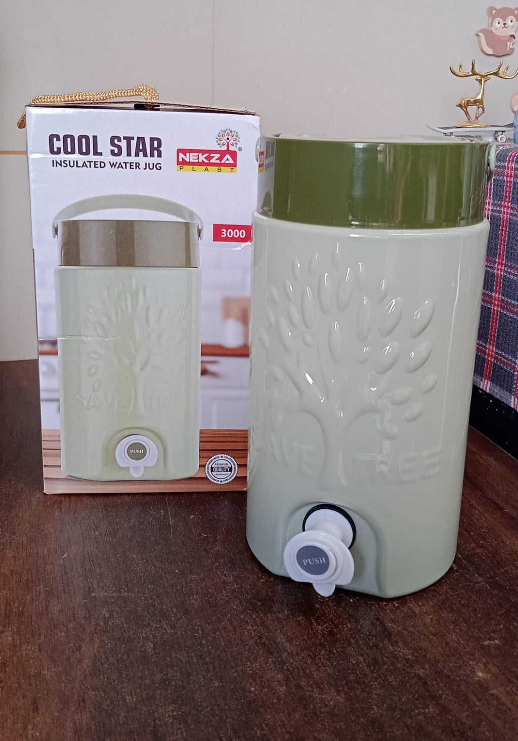 Durable insulated jug being carried by its sturdy handle, ready for adventure.