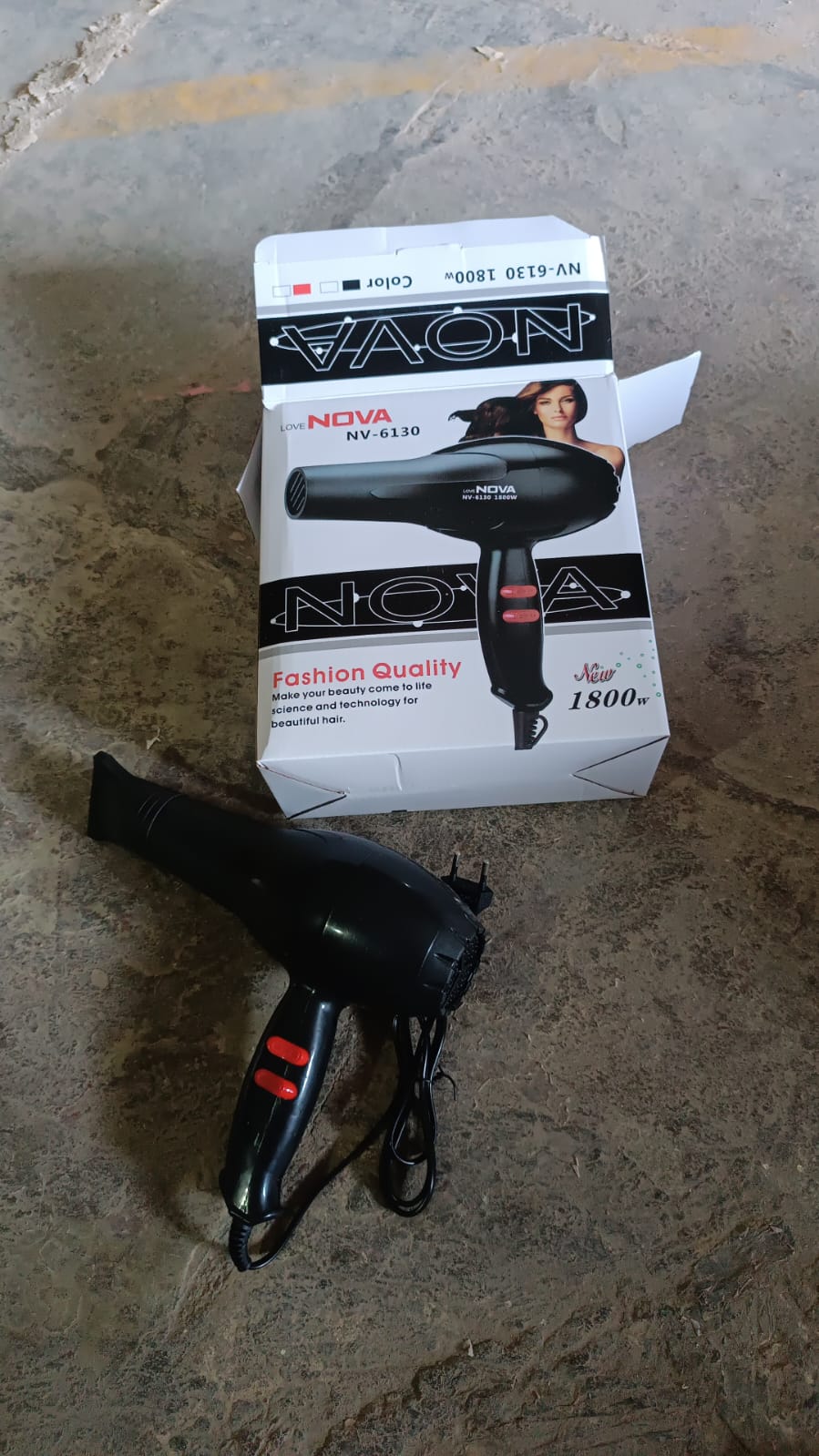 Calm & Curl brand logo on the side of the 1800W hair dryer.