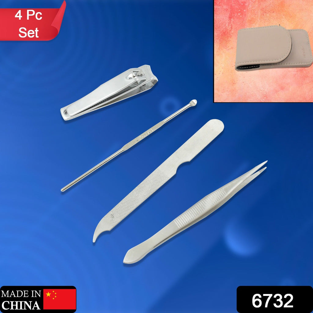 Open manicure kit showing nail clippers, scissors, and other stainless steel grooming tools.