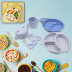 A complete 7-piece bamboo fibre baby feeding set with a charming cartoon design, laid out for display.