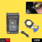Compact rechargeable LED keychain flashlight emitting a bright white light in the dark.