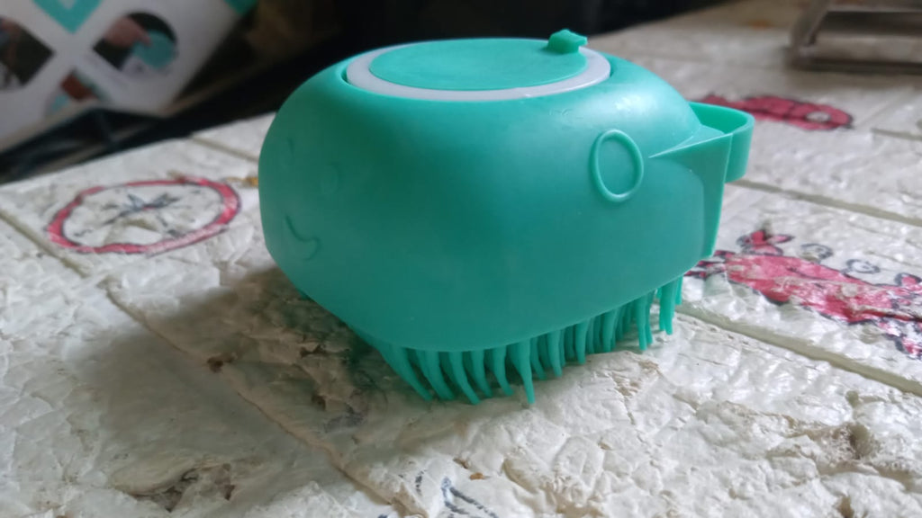 Person gently exfoliating their arm with the soft silicone bath brush.