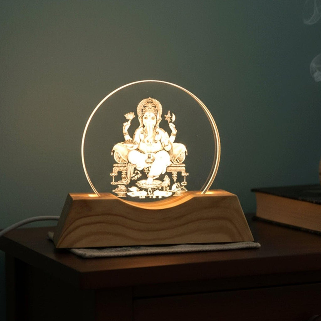 Front angle showing Lord Ganesha engraved acrylic LED table lamp