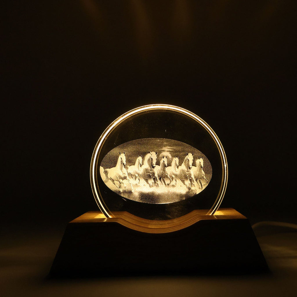 Clear crystal plate featuring 3D engraved running horses on LED table lamp