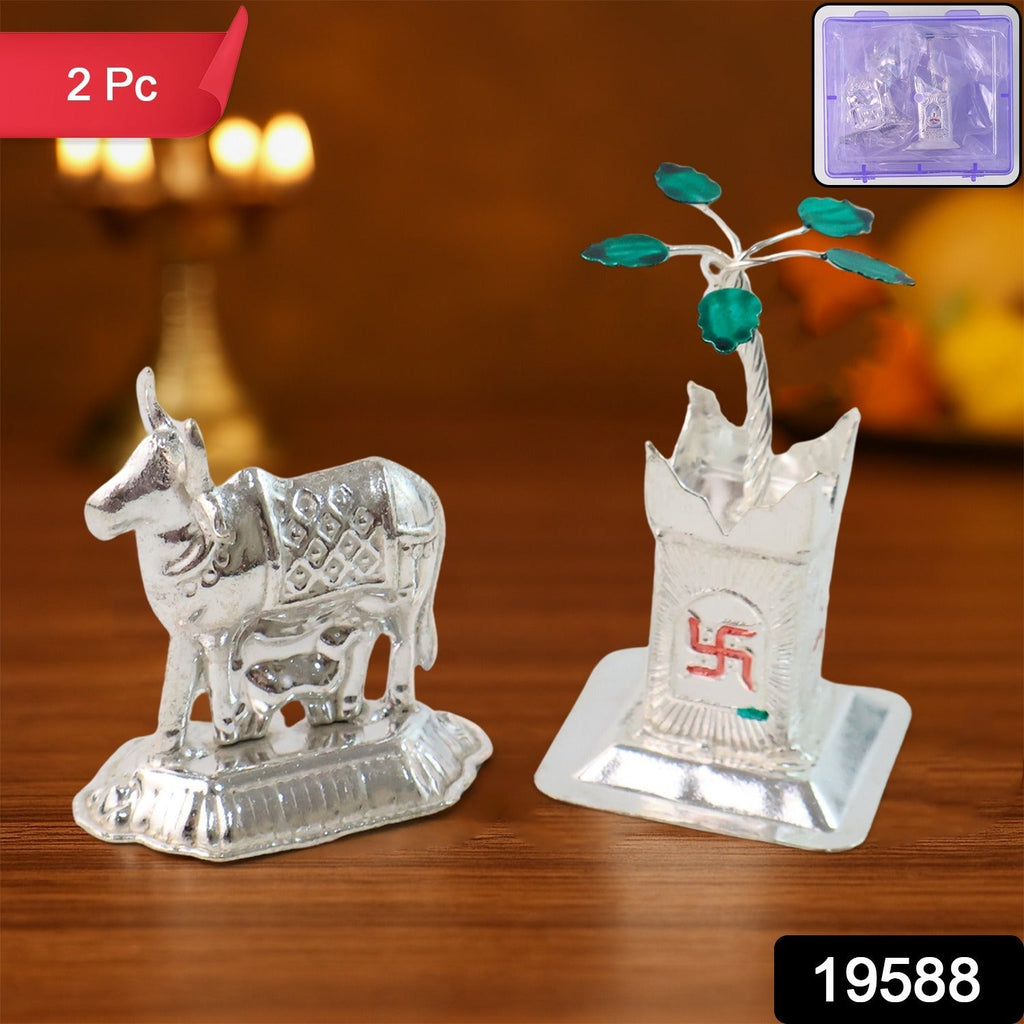 Close-up of sacred Kamdhenu cow silver-plated idol with calf for spiritual worship