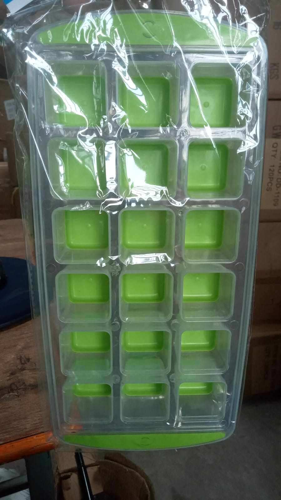 A single green 18-cavity silicone ice cube tray, showcasing its bright color and design.