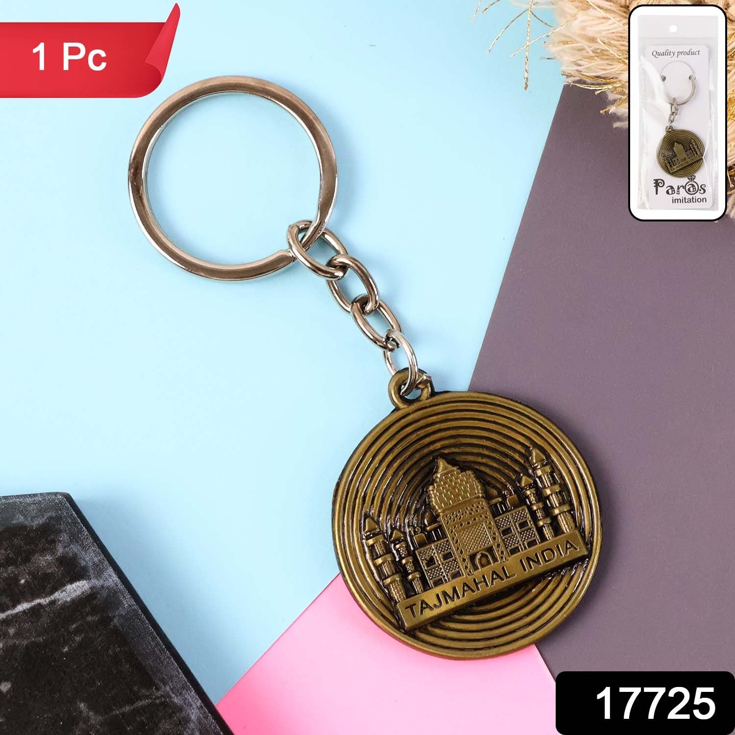 Close-up of Taj Mahal motif on antique brass keychain