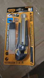 Person using the heavy-duty cutter knife to cut through thick material.
