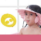 Adjustable baby shower cap in blue, protecting a child's eyes and ears during bath time.