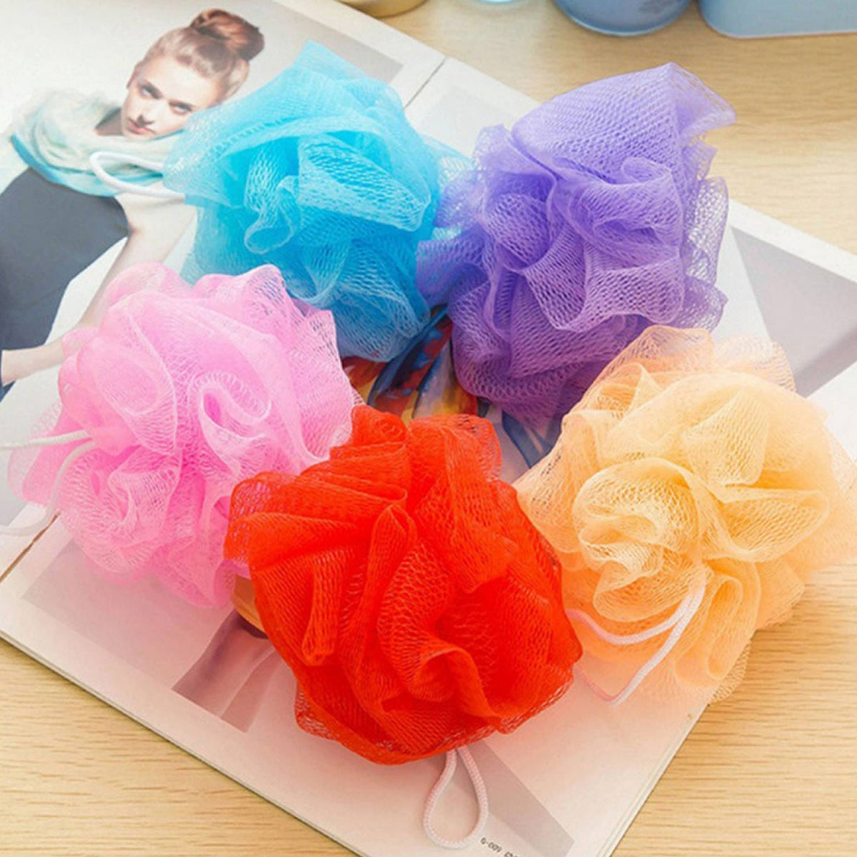 Set of 6 colorful bath loofah sponges, ideal for body scrubbing.
