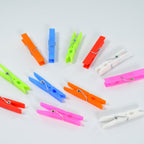 Vibrant set of 144 multi-purpose plastic clothes clips for laundry.