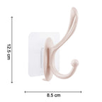 A heavy-duty self adhesive wall hook holding various items like keys and a small bag.