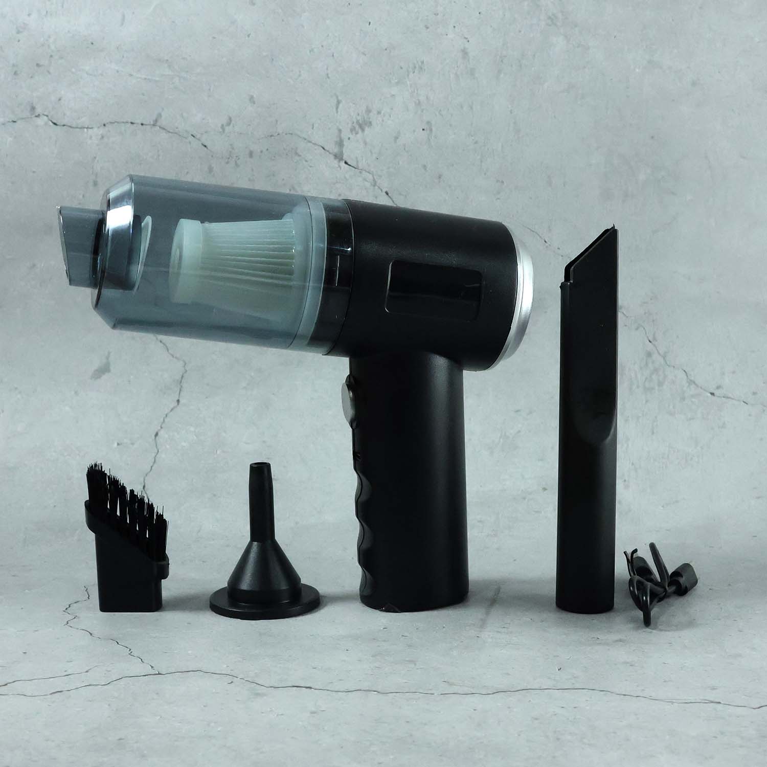 Close-up of the Mini Car Vacuum's nozzle and brush attachments.