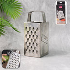 Stainless steel 4-in-1 compact grater and slicer front view showing versatile blades