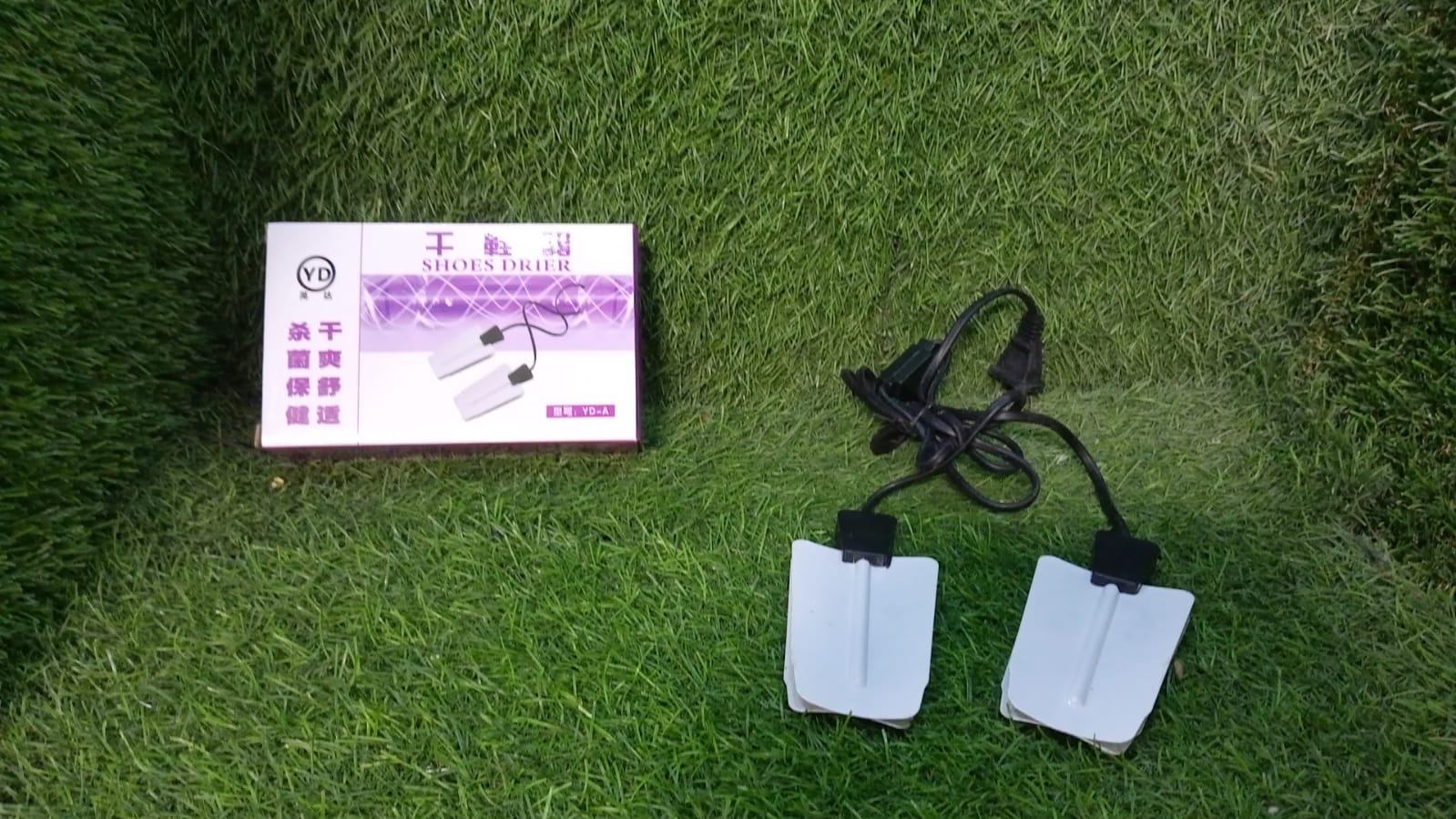 Compact shoe dryer with intelligent timing and USB feature, ideal for multiple uses.