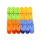 Strong plastic cloth drying clips in assorted vibrant colors.