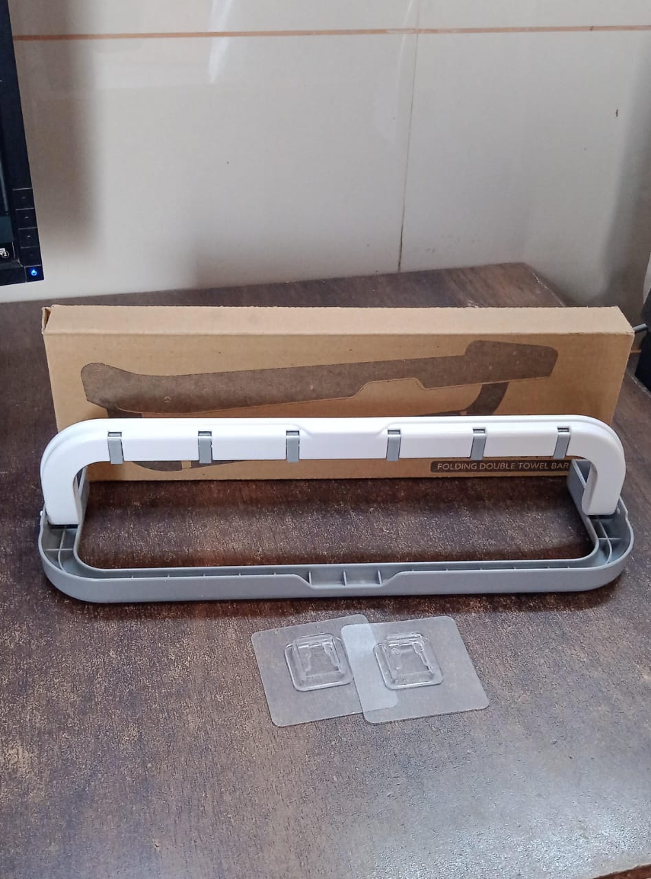 Stylish bathroom organizer with a folding shelf, enhancing storage without drilling.