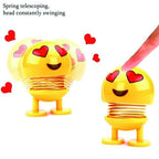 Emoticon smiling face spring figure, showcasing its compact size and joyful expression.