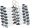 Close-up of adjustable anti-rust clips on a stainless steel hanger.