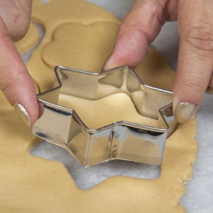 Close-up shot of the collection of stainless steel cookie cutters showing their varied sizes.