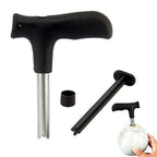 Stainless steel coconut opener tool with black handle on a white background.