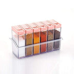 Close-up of multicolor plastic spice jars with their vibrant lids.