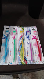 Ergonomic handle of a plastic toothbrush designed for comfortable grip for all ages.