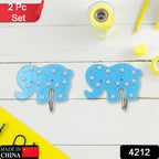 Two heavy-duty hooks holding kitchen utensils like a ladle and spatula.