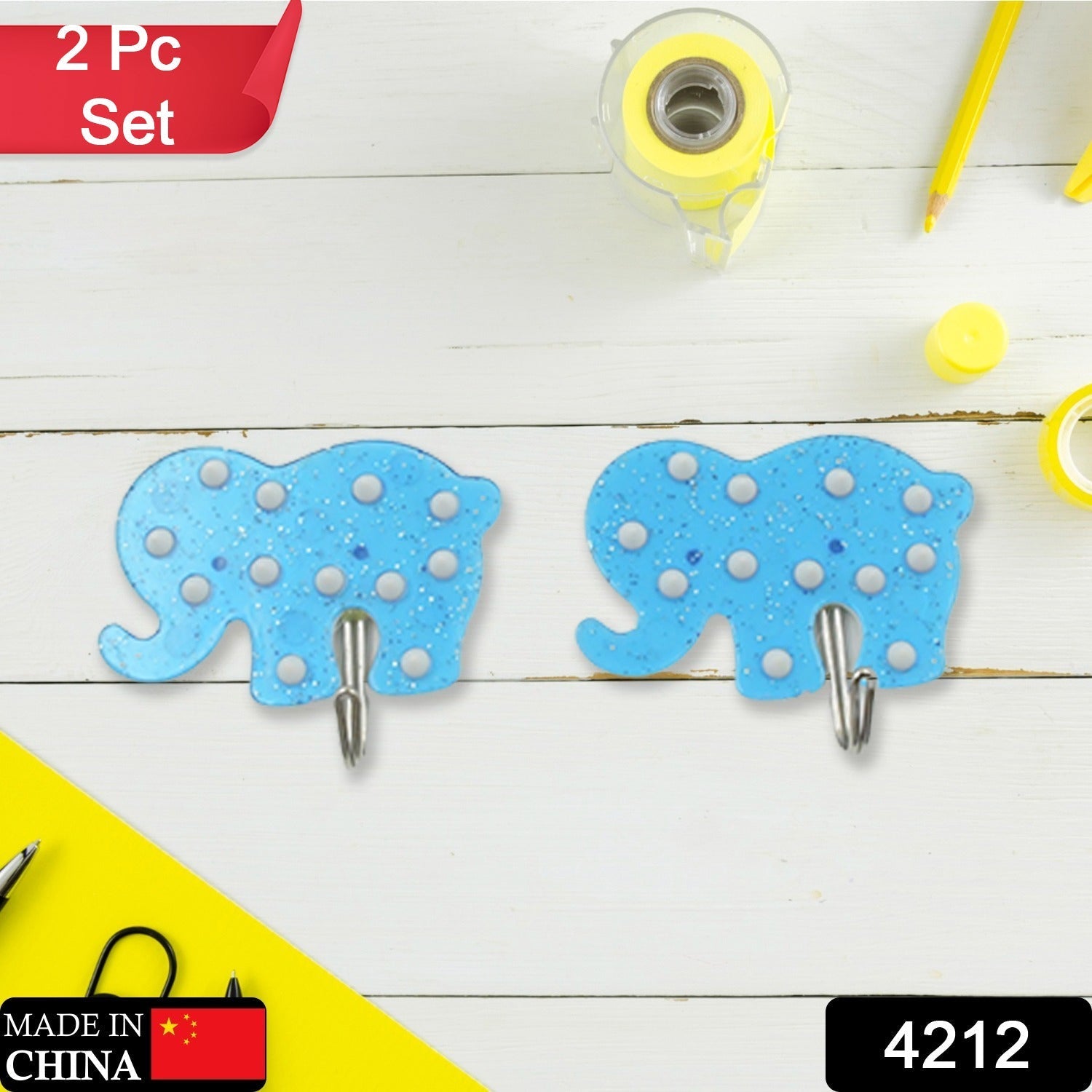 Two heavy-duty hooks holding kitchen utensils like a ladle and spatula.