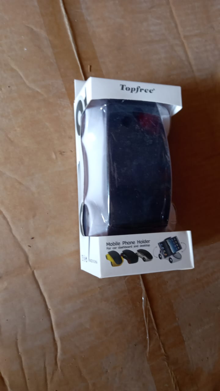 Side view of the sports car phone holder mounted on a car dashboard.