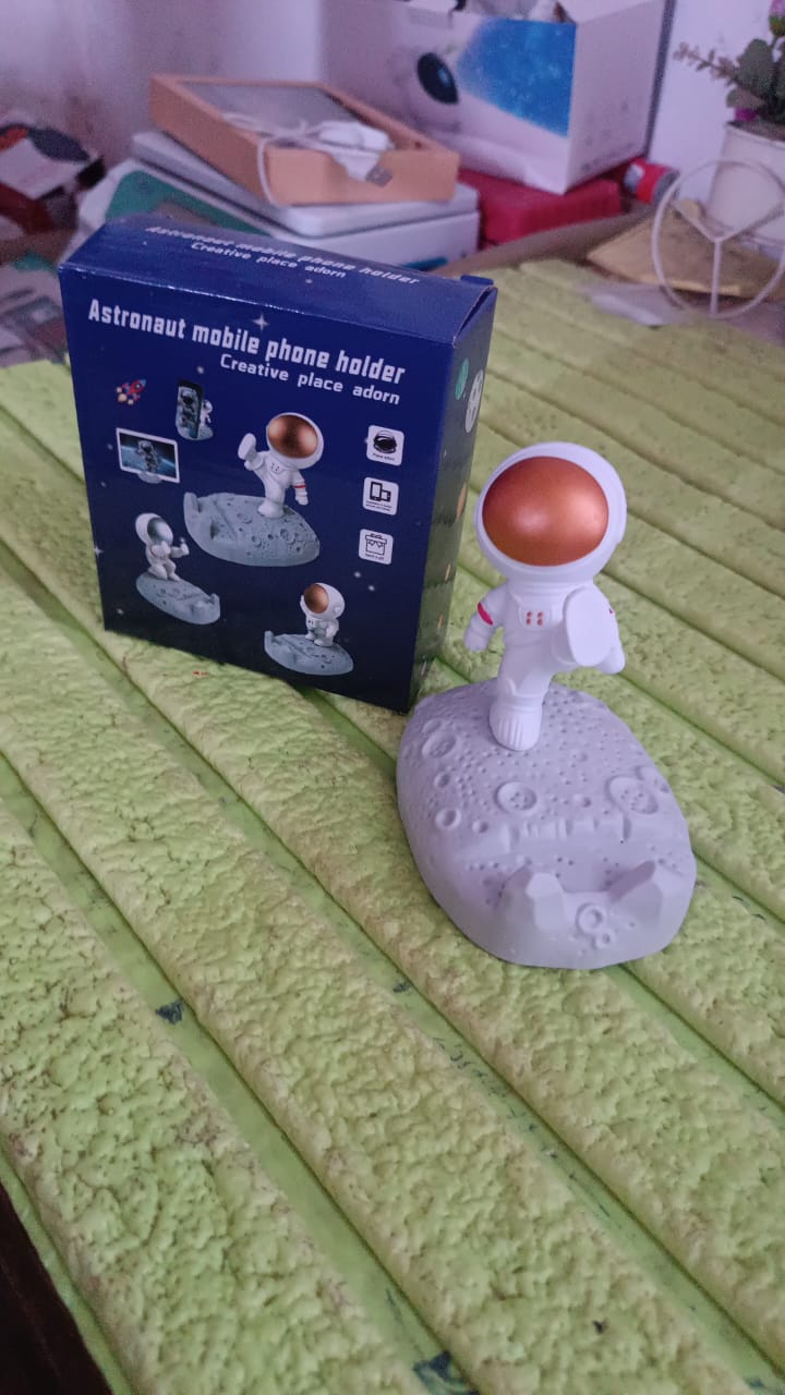 Overhead view of the creative Astronaut Phone Stand, showing its compact form.