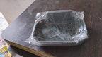 Compact soap dish holder neatly mounted in a shower area, saving space.