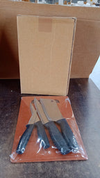 Kitchen tools including stainless steel knives and plastic chopping board for easy food preparation