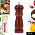 Close-up view of a classic wooden pepper mill, showcasing its natural grain and smooth finish.