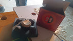 Matte black ceramic tea set displayed on a wooden table for tea time
