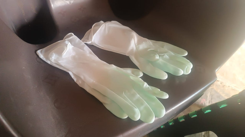 SparkleTidy yellow rubber gloves ensuring hygiene in Indian homes.