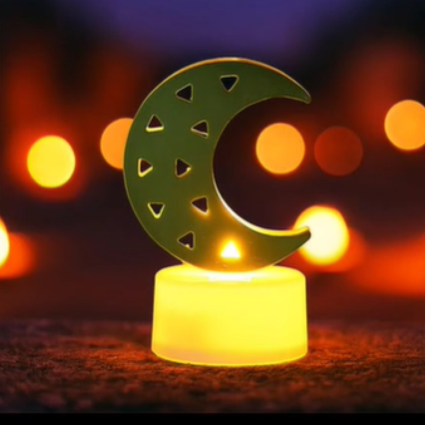 Set of four moon shaped flameless LED candles glowing warmly for event decoration