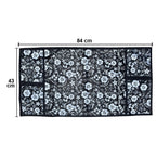 Microwave dust cover with an elegant design protecting a kitchen appliance.
