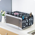 Stylish microwave oven cover with utility pockets in a modern kitchen setting.