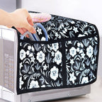 Detailed view of the four practical utility pockets on the side of the oven cover.