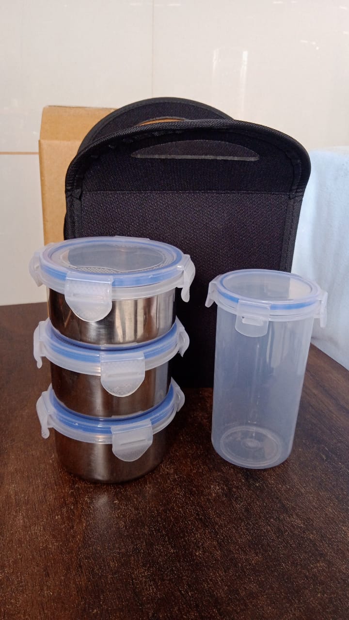 Complete 4-piece stainless steel tiffin set with sleek design for daily use.