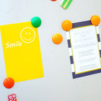 Detailed shot of a single vibrant circular board magnet.