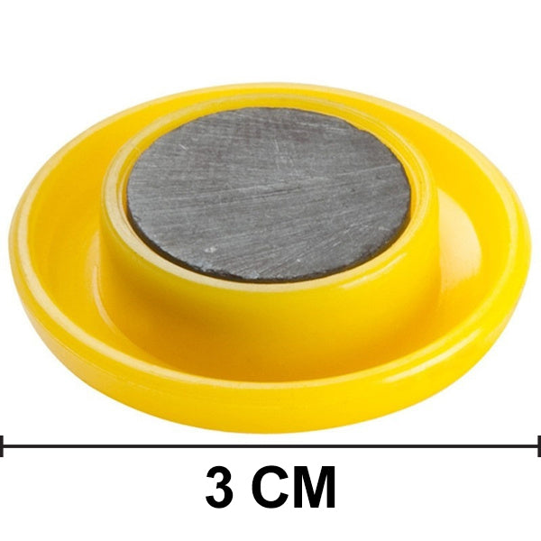 Collection of colorful circular board magnets on a flat surface.
