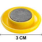 Collection of colorful circular board magnets on a flat surface.