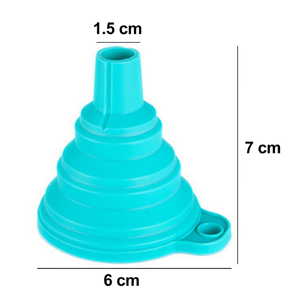 Red silicone funnel pouring juice into a glass bottle on a kitchen counter.